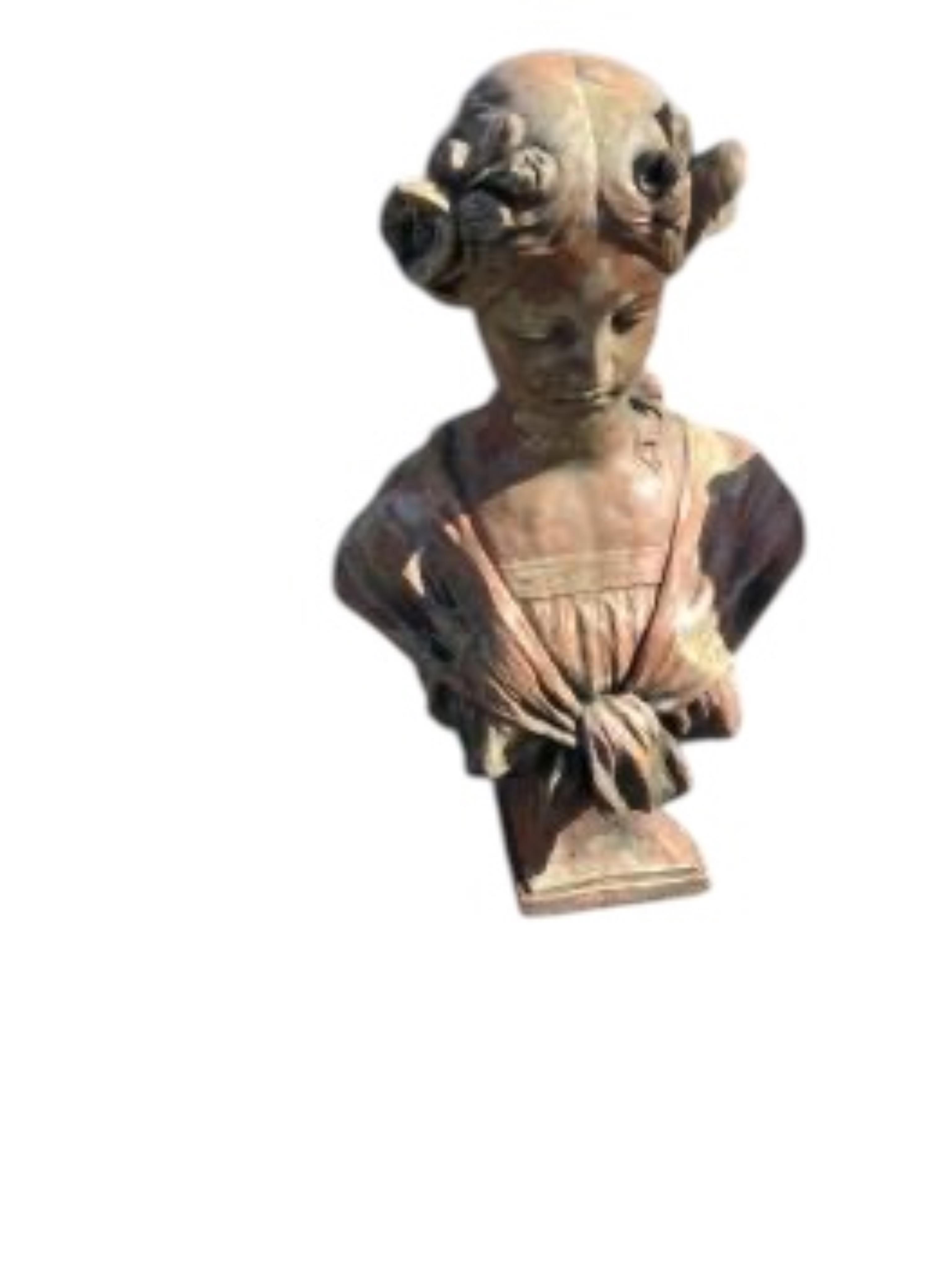 Four cast stone and terracotta garden busts, largest height 46cm